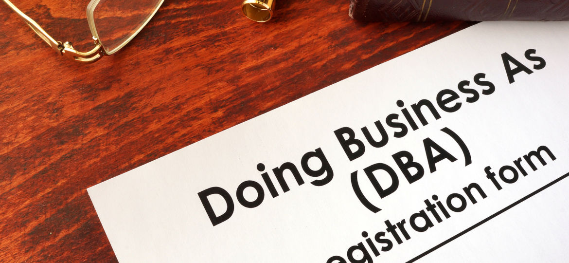 DBA Registration doing business as form on a table.